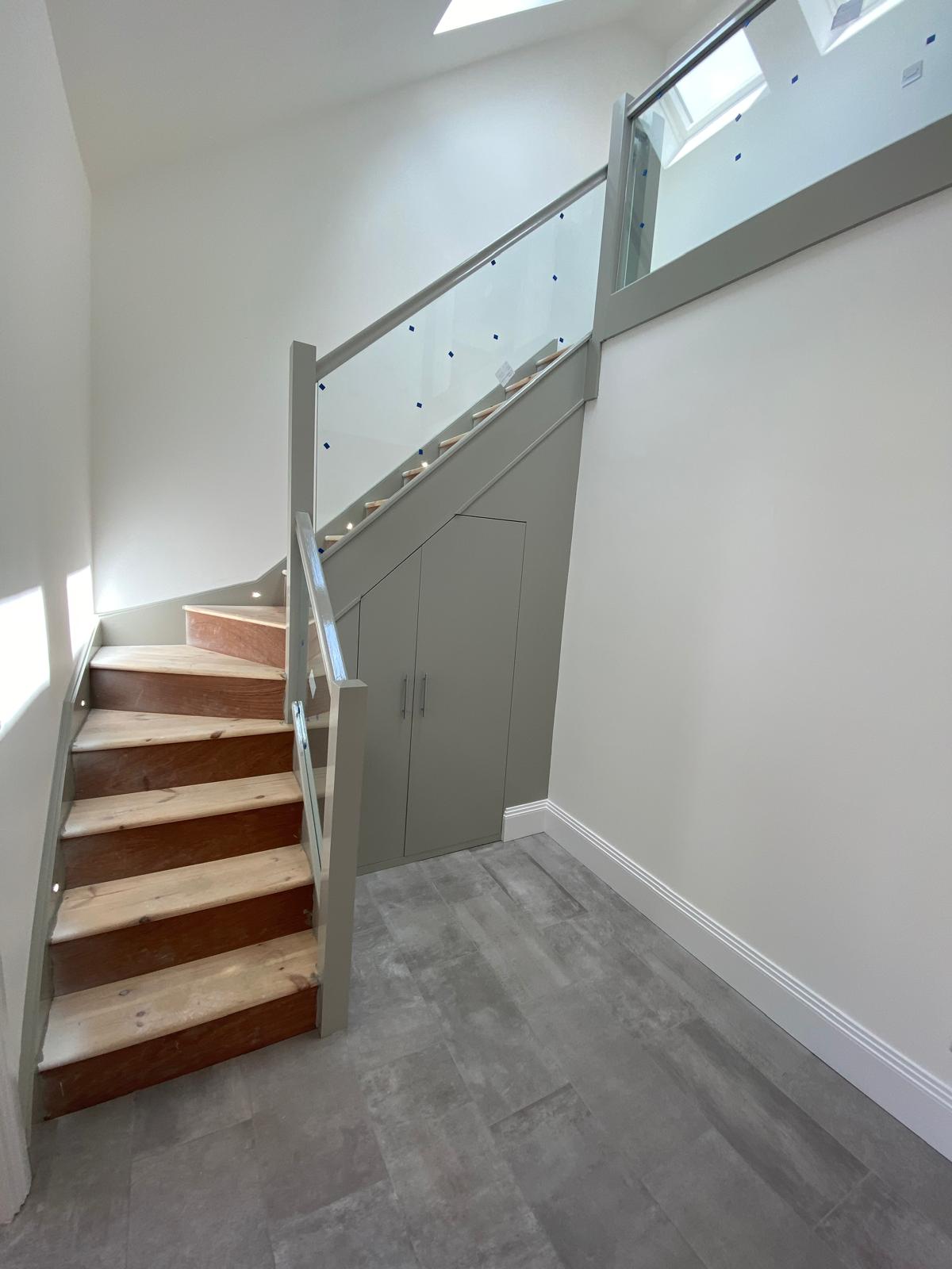 New timber staircase framed up to the converted loft