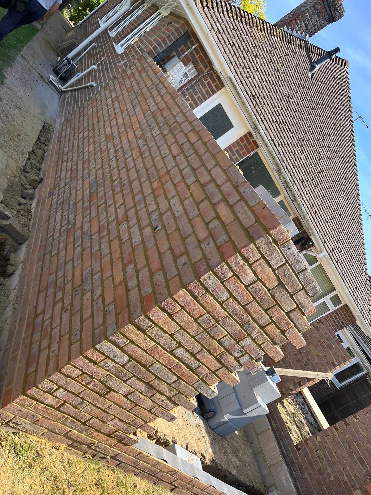 Curved brick herringbone driveway