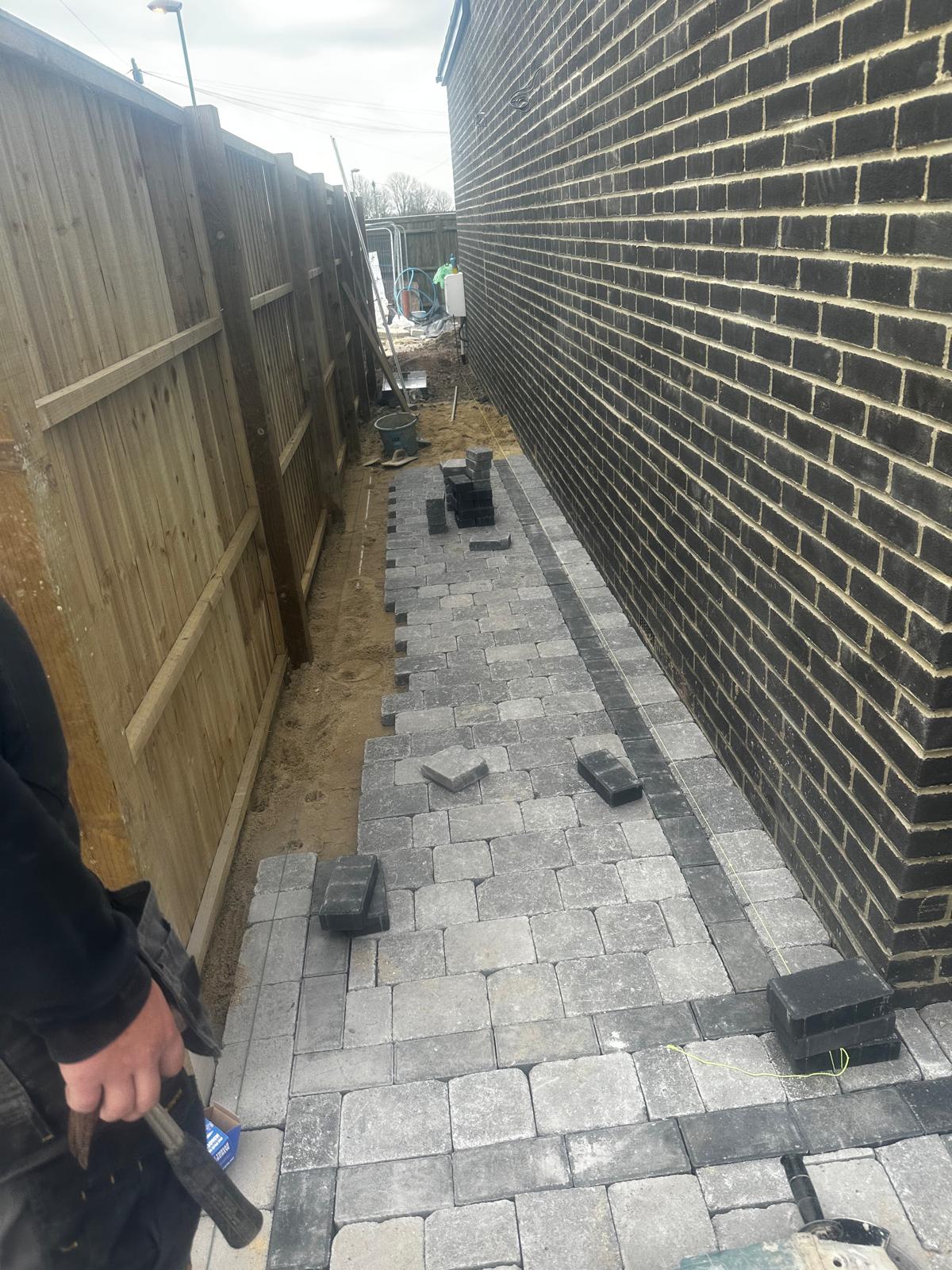 Block-paved side path being laid