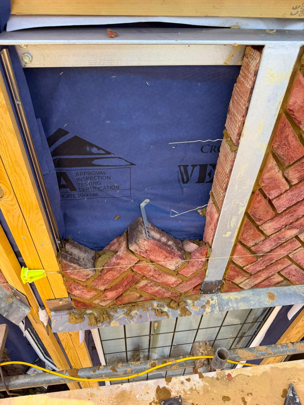 Reclaimed brick herringbone infill panel detail