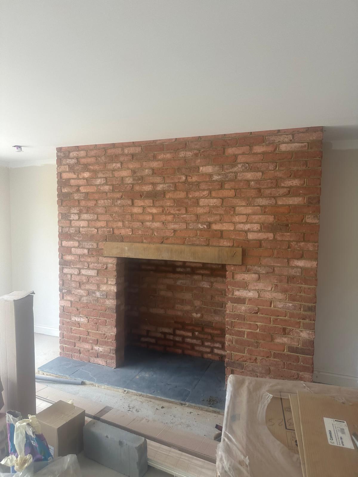 Internal reclaimed brick chimney breast and fireplace