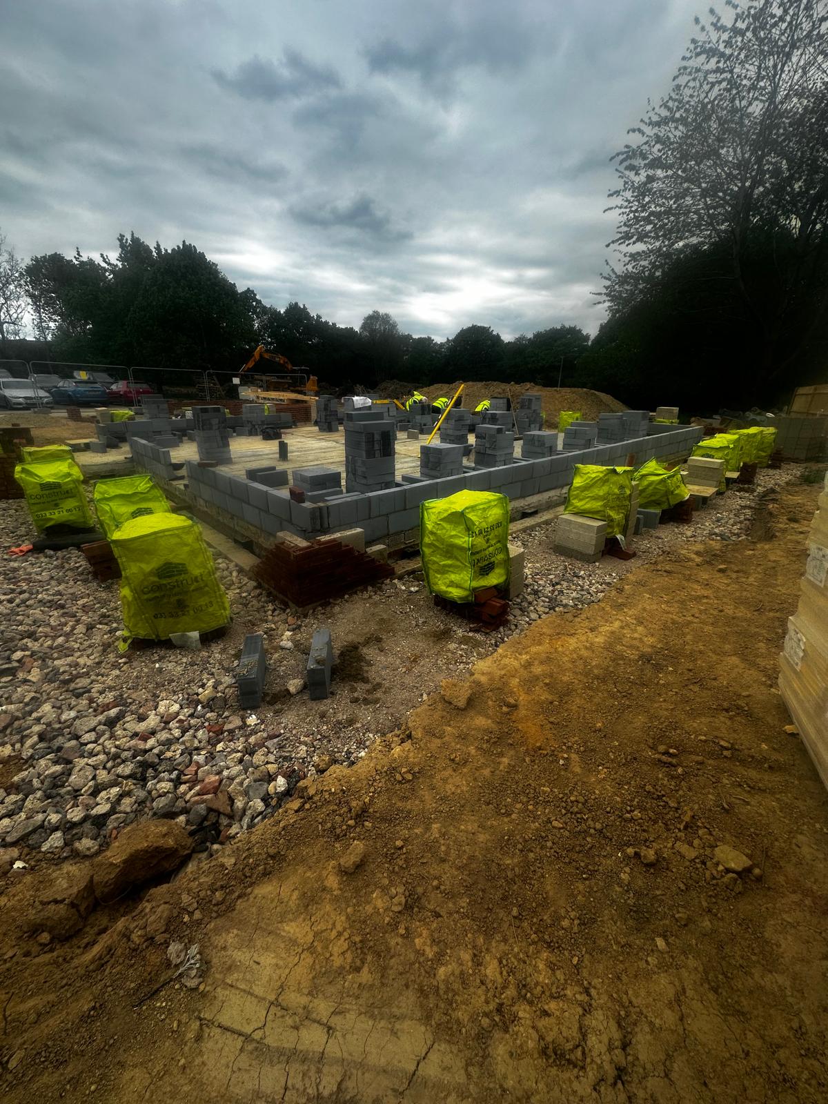 Perimeter blockwork underway across the slab